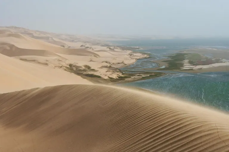 Sand dunes beside the lagoon and Atlantic coastline at Sandwich Harbour